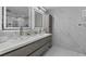 Elegant bathroom with double vanity, marble walls, and modern fixtures at 14040 Cascade Ln, Tampa, FL 33618