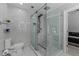Modern bathroom with a large walk-in shower and marble tile at 14040 Cascade Ln, Tampa, FL 33618