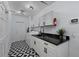 Laundry room with modern cabinets and black countertop at 14040 Cascade Ln, Tampa, FL 33618