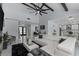 Open concept living area with white sectional sofa and marble floors at 14040 Cascade Ln, Tampa, FL 33618