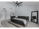 Main bedroom with large bed, plenty of natural light and large mirror at 14040 Cascade Ln, Tampa, FL 33618