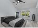 Spacious bedroom with large bed, walk-in closet and backyard view at 14040 Cascade Ln, Tampa, FL 33618