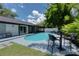 Relaxing poolside space with patio furniture and tranquil atmosphere at 14040 Cascade Ln, Tampa, FL 33618