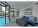 Relaxing screened patio with comfortable seating and pool view at 14040 Cascade Ln, Tampa, FL 33618