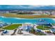 Aerial view of the large lagoon, splash park, pavilion, and sandy beach at 17014 Clear Cork Dr, Wimauma, FL 33598
