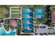 Aerial view of tennis courts, bocce ball, and a swimming pool next to clubhouse at 17014 Clear Cork Dr, Wimauma, FL 33598