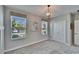 Bedroom showcasing natural light, a modern chandelier and closet at 17014 Clear Cork Dr, Wimauma, FL 33598