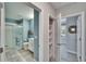 Hallway view showing bathroom, linen closet and a bedroom at 17014 Clear Cork Dr, Wimauma, FL 33598