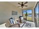 Enjoy outdoor living on this screened patio with comfortable seating and decorative touches at 17014 Clear Cork Dr, Wimauma, FL 33598