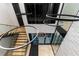 View of a modern staircase and entryway with unique light fixtures at 2081 Michigan Ne Ave, St Petersburg, FL 33703