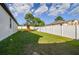 Backyard with playset and white fence at 2252 Maximilian Ave, Spring Hill, FL 34609