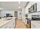 Modern kitchen with stainless steel appliances and white cabinetry at 2252 Maximilian Ave, Spring Hill, FL 34609