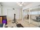 Bedroom featuring mirrored closet, exercise equipment, and an open doorway at 2381 Ecuadorian Way # 33, Clearwater, FL 33763