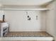 This is an empty laundry room with a shelf, hookups and outlets at 2381 Ecuadorian Way # 33, Clearwater, FL 33763