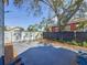 Backyard with concrete patio, wood chips, and white fence at 2427 10Th S Ave, St Petersburg, FL 33712