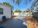 Backyard with concrete patio, wood chips, and white fence at 2427 10Th S Ave, St Petersburg, FL 33712