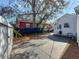 Backyard with concrete patio, wood chips, and white fence at 2427 10Th S Ave, St Petersburg, FL 33712