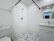 Modern bathroom with white tile, walk-in shower, and new vanity at 2427 10Th S Ave, St Petersburg, FL 33712