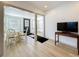 Bright dining area with glass-top table and wood-look floors at 2427 10Th S Ave, St Petersburg, FL 33712