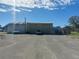 Commercial building with large overhead doors and ample parking at 2601 11Th Se Ave, Ruskin, FL 33570