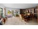 Dining area with a wooden table, built-in shelving, and backyard access at 263 42Nd Ne Ave, St Petersburg, FL 33703
