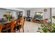 Bright dining area with wood table, chairs, and access to the living room at 263 42Nd Ne Ave, St Petersburg, FL 33703
