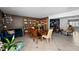 Spacious dining area with large wooden table and access to living room and library at 263 42Nd Ne Ave, St Petersburg, FL 33703