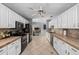 Modern kitchen with white cabinets and stainless steel appliances at 263 42Nd Ne Ave, St Petersburg, FL 33703