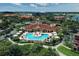 Aerial view of community pool and clubhouse at 2738 Via Tivoli # 220B, Clearwater, FL 33764