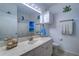 Charming bathroom with a vanity and shower/tub combo at 2738 Via Tivoli # 220B, Clearwater, FL 33764