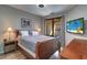 Spacious bedroom with wood flooring and private balcony access at 2738 Via Tivoli # 220B, Clearwater, FL 33764