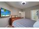 Spacious bedroom with large TV and ample closet space at 2738 Via Tivoli # 220B, Clearwater, FL 33764