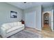 Comfortable bedroom with a cozy sofa and built-in closet at 2738 Via Tivoli # 220B, Clearwater, FL 33764