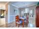 Elegant dining room with hardwood floors and large windows at 2738 Via Tivoli # 220B, Clearwater, FL 33764