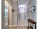 Bright and spacious entryway with tile flooring and access to bathroom at 2738 Via Tivoli # 220B, Clearwater, FL 33764