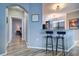 Hallway with view into kitchen and bedroom at 2738 Via Tivoli # 220B, Clearwater, FL 33764