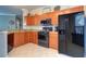 Updated kitchen with granite countertops and stainless steel appliances at 2738 Via Tivoli # 220B, Clearwater, FL 33764