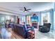Open living room featuring hardwood floors, fireplace and ample natural light at 2738 Via Tivoli # 220B, Clearwater, FL 33764