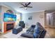 Spacious living room with hardwood floors, fireplace and ample natural light at 2738 Via Tivoli # 220B, Clearwater, FL 33764