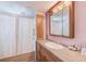 Clean bathroom features a vanity, tub shower combo, and medicine cabinet at 27466 Us Highway 19 N # 78, Clearwater, FL 33761