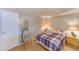 Cozy bedroom with a double bed, lamp, and chair at 27466 Us Highway 19 N # 78, Clearwater, FL 33761