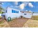 Side view of the home showing exterior features at 27466 Us Highway 19 N # 78, Clearwater, FL 33761