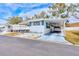 Mobile home exterior with carport and yard at 27466 Us Highway 19 N # 78, Clearwater, FL 33761