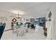 Bright dining room with glass table and chandelier at 2835 Somerset Park Dr # 203, Tampa, FL 33613