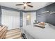 Bedroom with a bed, dresser, and access to upper loft area at 31211 Gossamer Way, Wesley Chapel, FL 33543