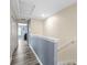 Upstairs hallway featuring updated flooring and neutral paint tones at 31211 Gossamer Way, Wesley Chapel, FL 33543
