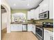 Modern kitchen with granite counters and stainless steel appliances at 31211 Gossamer Way, Wesley Chapel, FL 33543
