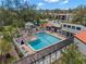 Community pool and surrounding complex view from above at 3245 Beneva Rd # 201, Sarasota, FL 34232