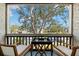 Private balcony overlooking a treetop view at 3245 Beneva Rd # 201, Sarasota, FL 34232