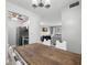 Bright dining area with wood table and view of living room at 3245 Beneva Rd # 201, Sarasota, FL 34232